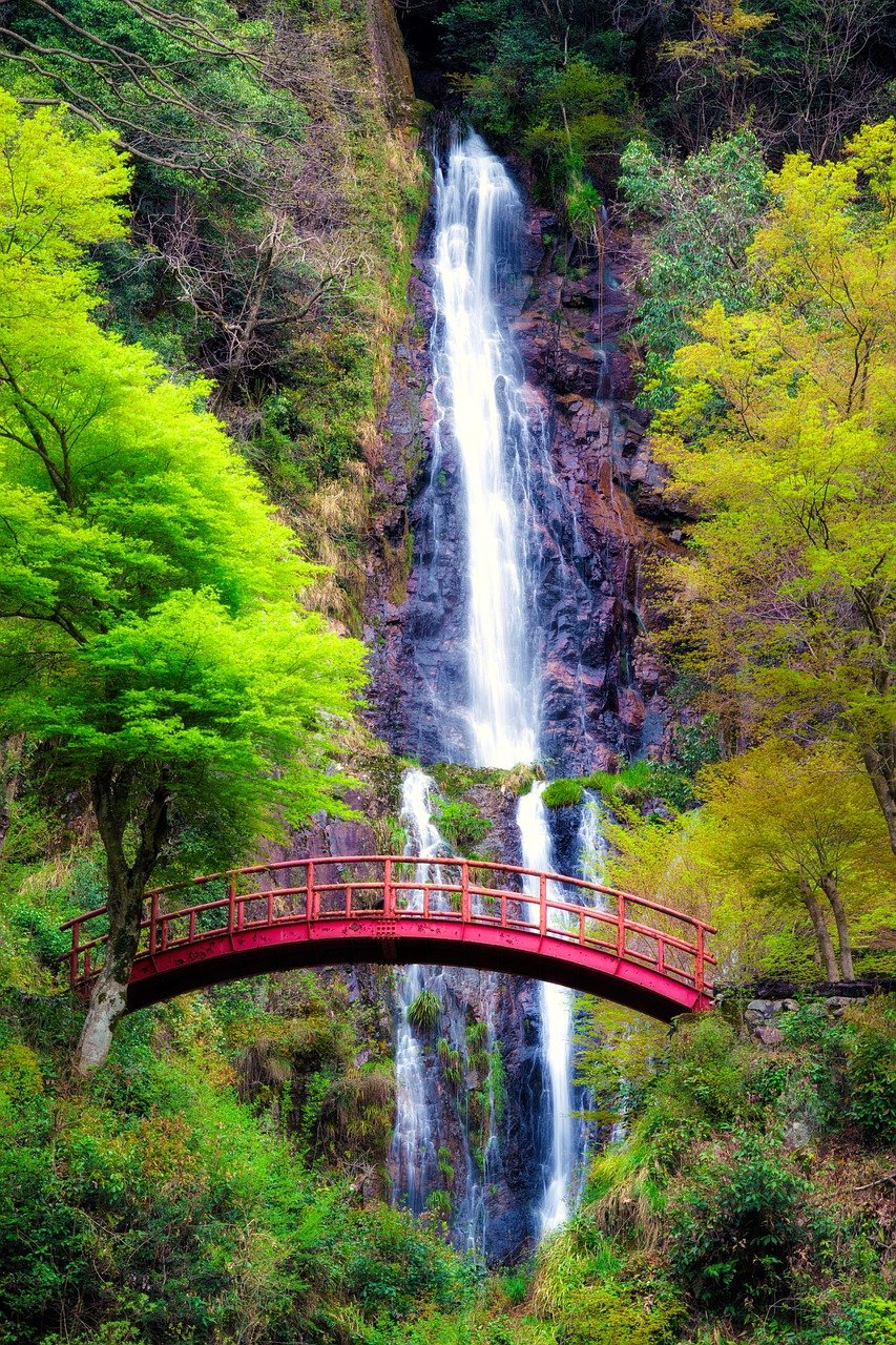 Explore Japan’s Nature – Scenic Waterfall and Red Bridge View