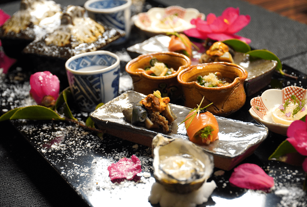 Beautifully arranged kaiseki dinner served at a traditional ryokan in Yufuin